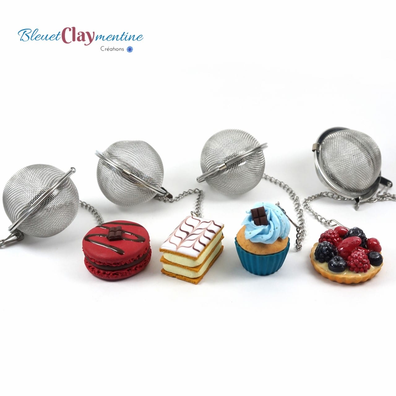 https://bleuetclaymentine.fr/wp-content/uploads/2018/06/boules-%C3%A0-th%C3%A9-gourmandes-macaron-mille-feuille-cupcake-tarte-polym%C3%A8re-fimo-polymerclay.jpg