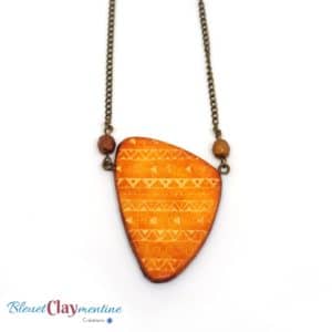 Collier motifs ethniques inspiration aztèque orange et brun